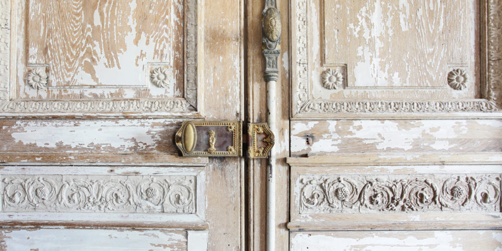 Old stripped door with its decorative hardware